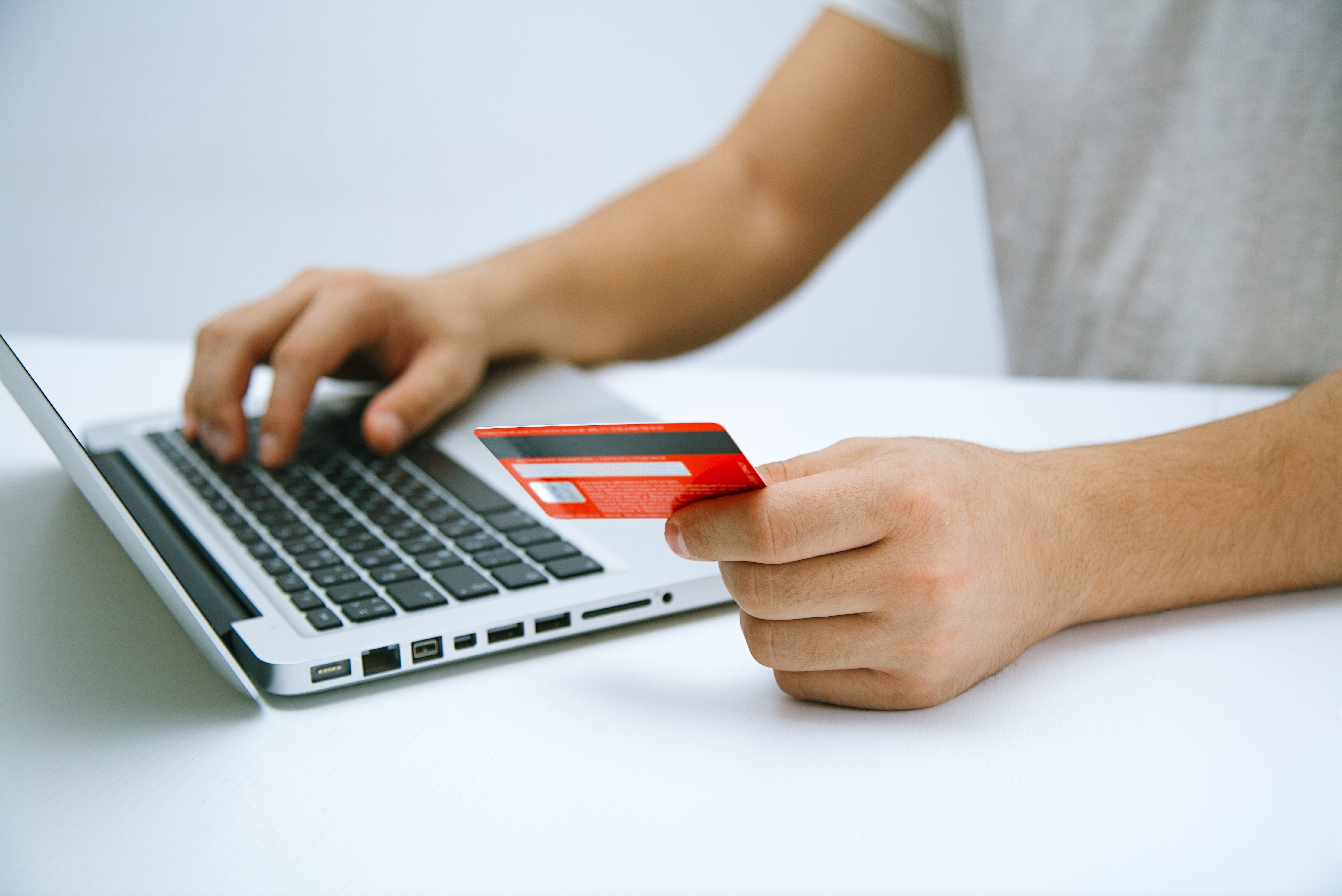 Card Payment Laptop Man making a card payment via ecommerce on a laptop